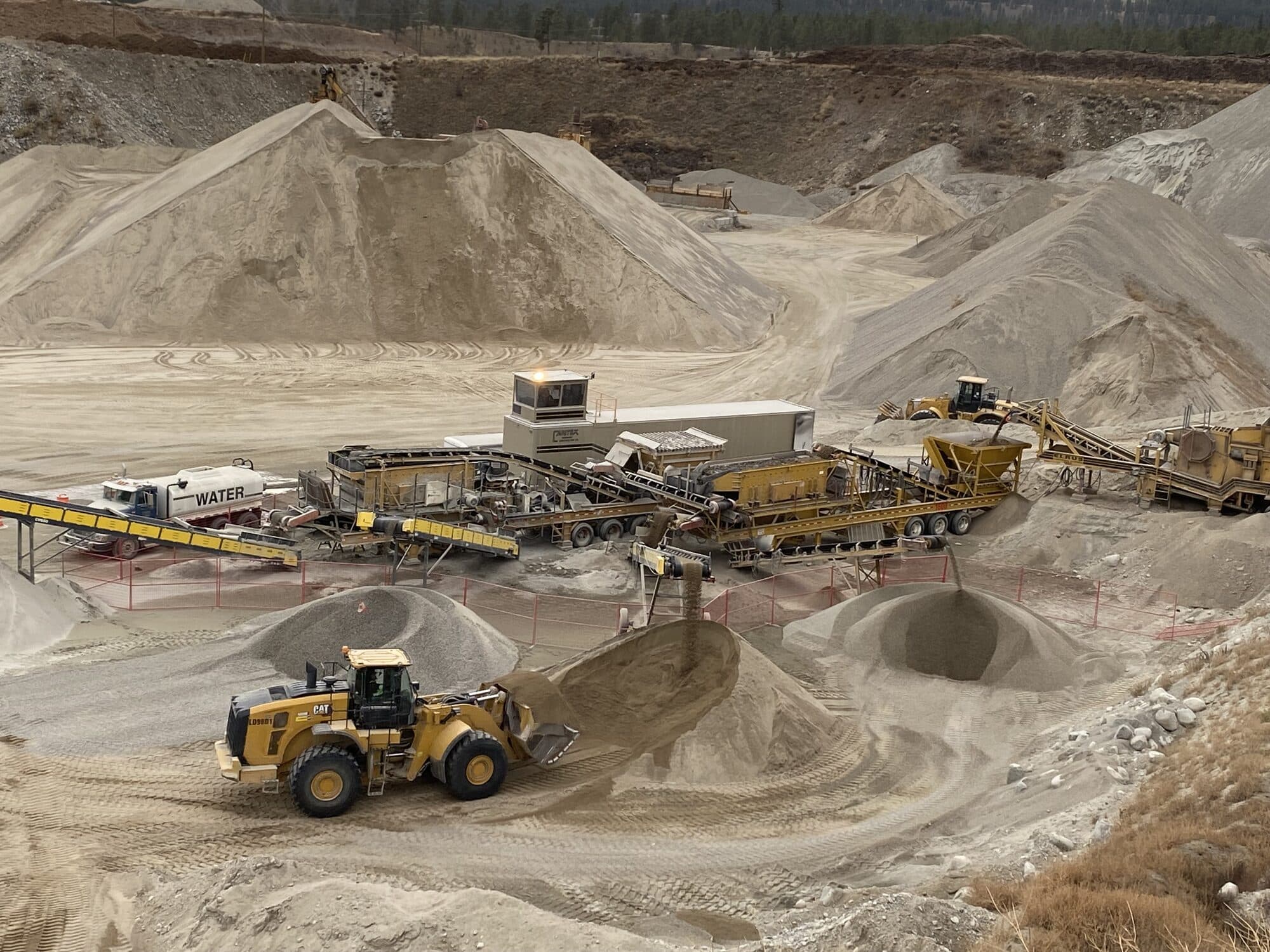 A Cantex crushing and screening spread working stockpiles.
