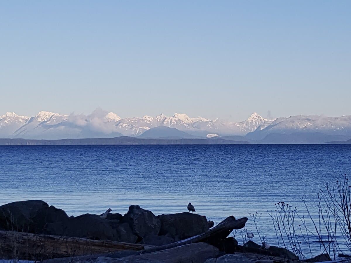 The Campbell River shoreline looking across Discovery Passage to the snow-capped Coast Mountains.