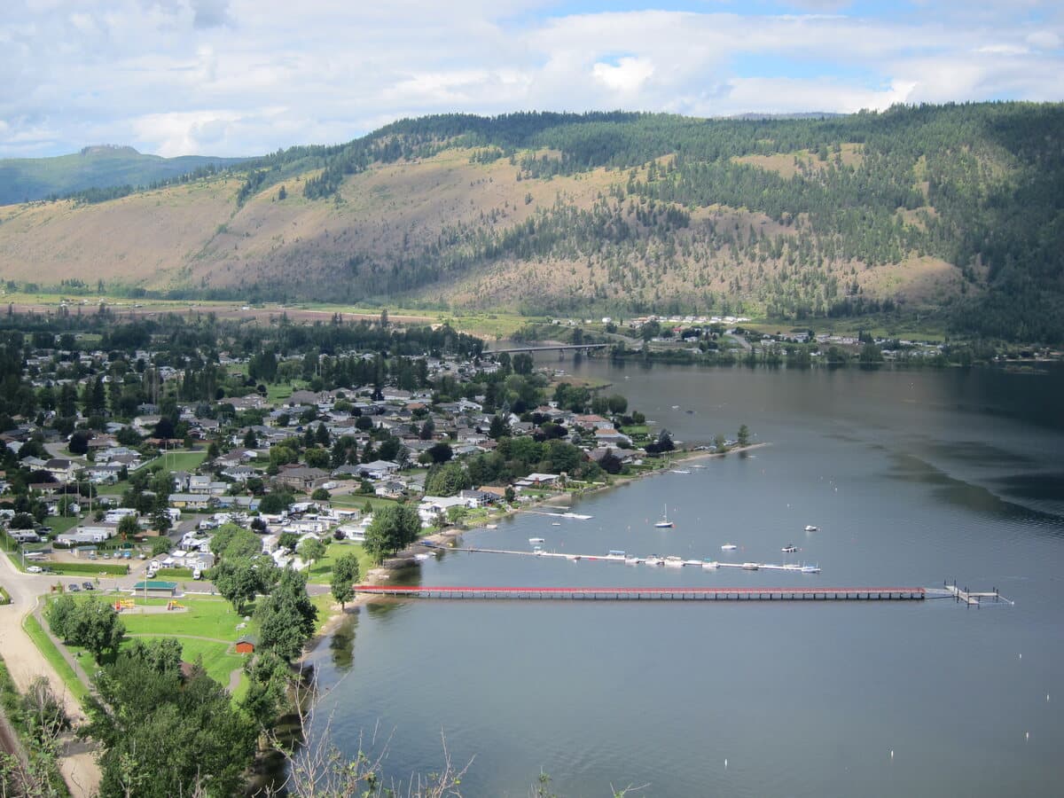The village of Chase on the shore of Little Shuswap Lake, showing the waterfront, marina and the hills across the lake.