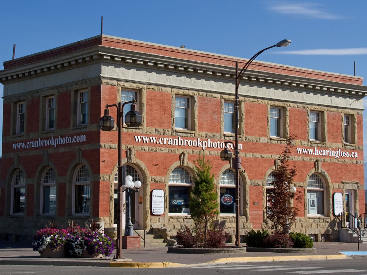 A restored heritage brick building on a downtown street corner in Cranbrook.