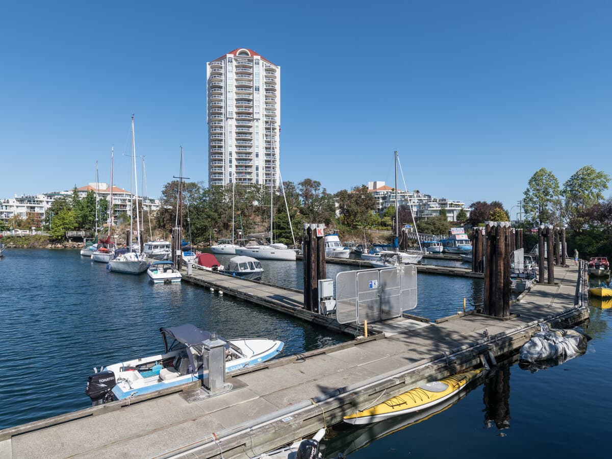 Nanaimo Harbour with the marina docks, moored boats and the downtown waterfront highrises behind.
