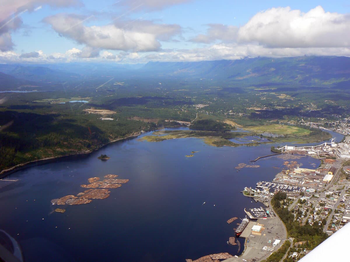 Aerial view of Port Alberni at the head of the Alberni Inlet, showing the harbour, the town and the surrounding valley.